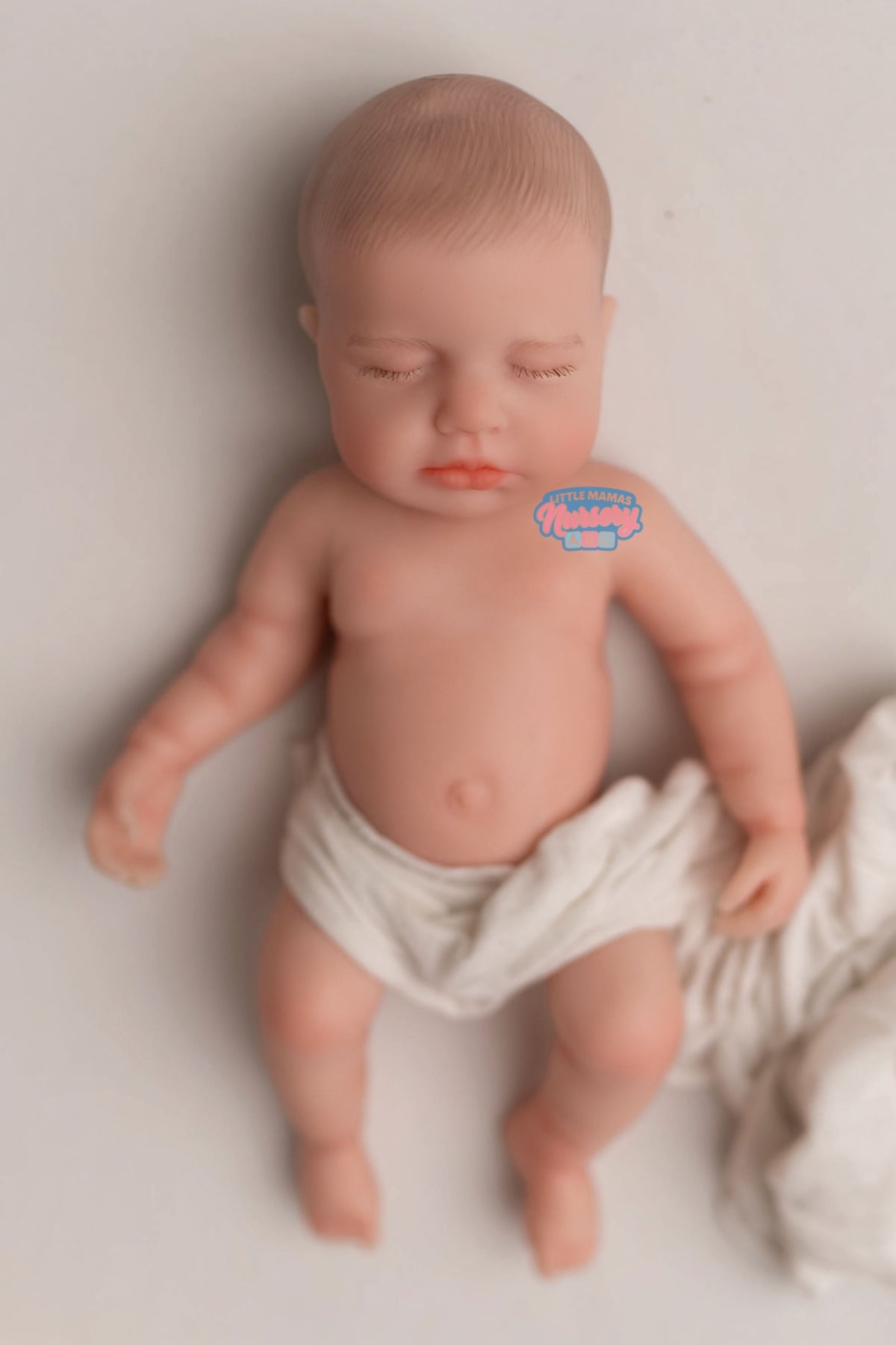 Palmer, 18-inch fully platinum silicone baby doll (front view) — Little Mamas Nursery