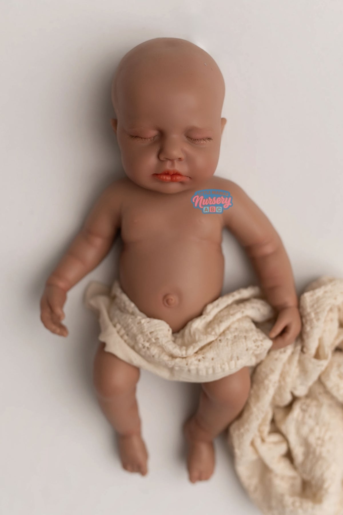 Palmer, 12-inch fully platinum silicone baby doll (side view) — Little Mamas Nursery