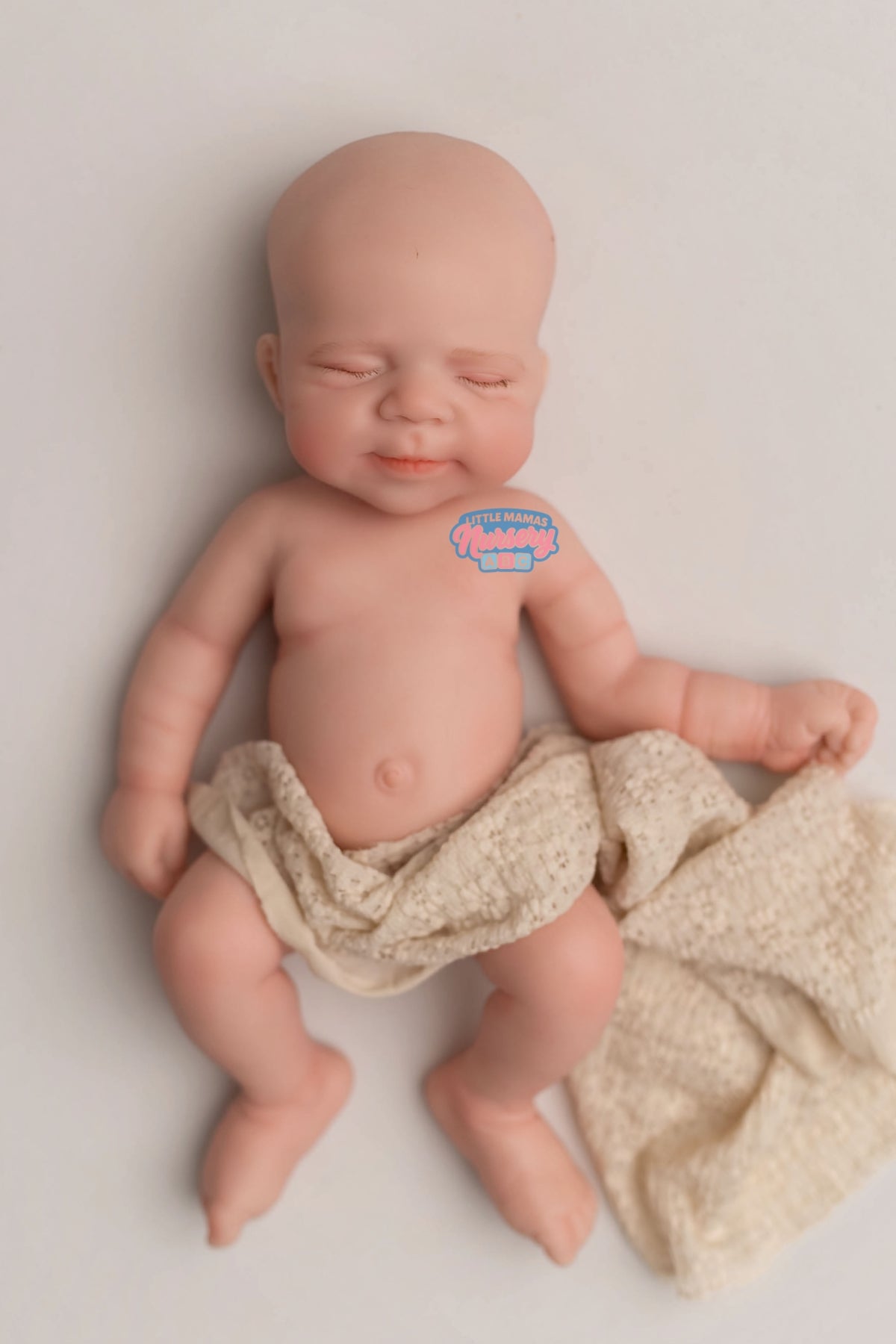 Wells, 18-inch fully platinum silicone baby doll (front view) — Little Mamas Nursery